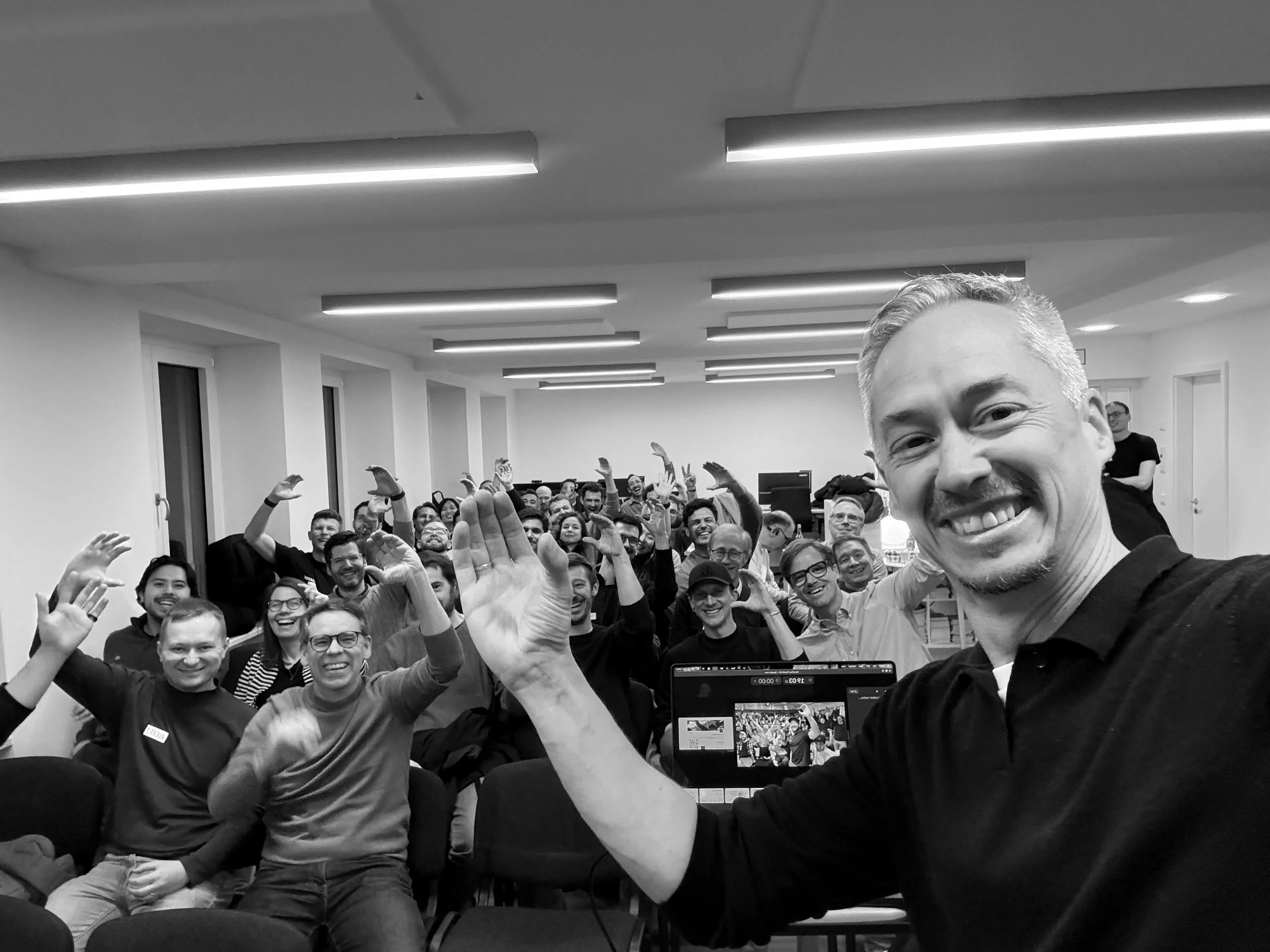 OpenClaw Munich Meetup #1 — 60 attendees with hands raised