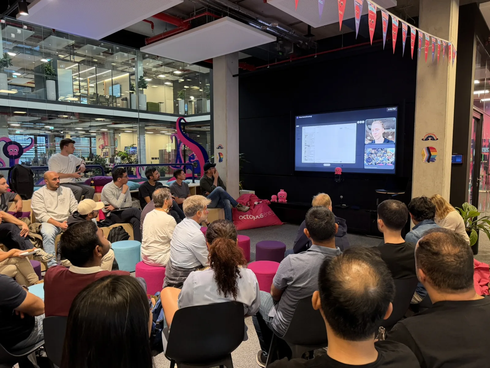 Attendees watching Tilman Resch's remote Codex demonstration on the venue screen.